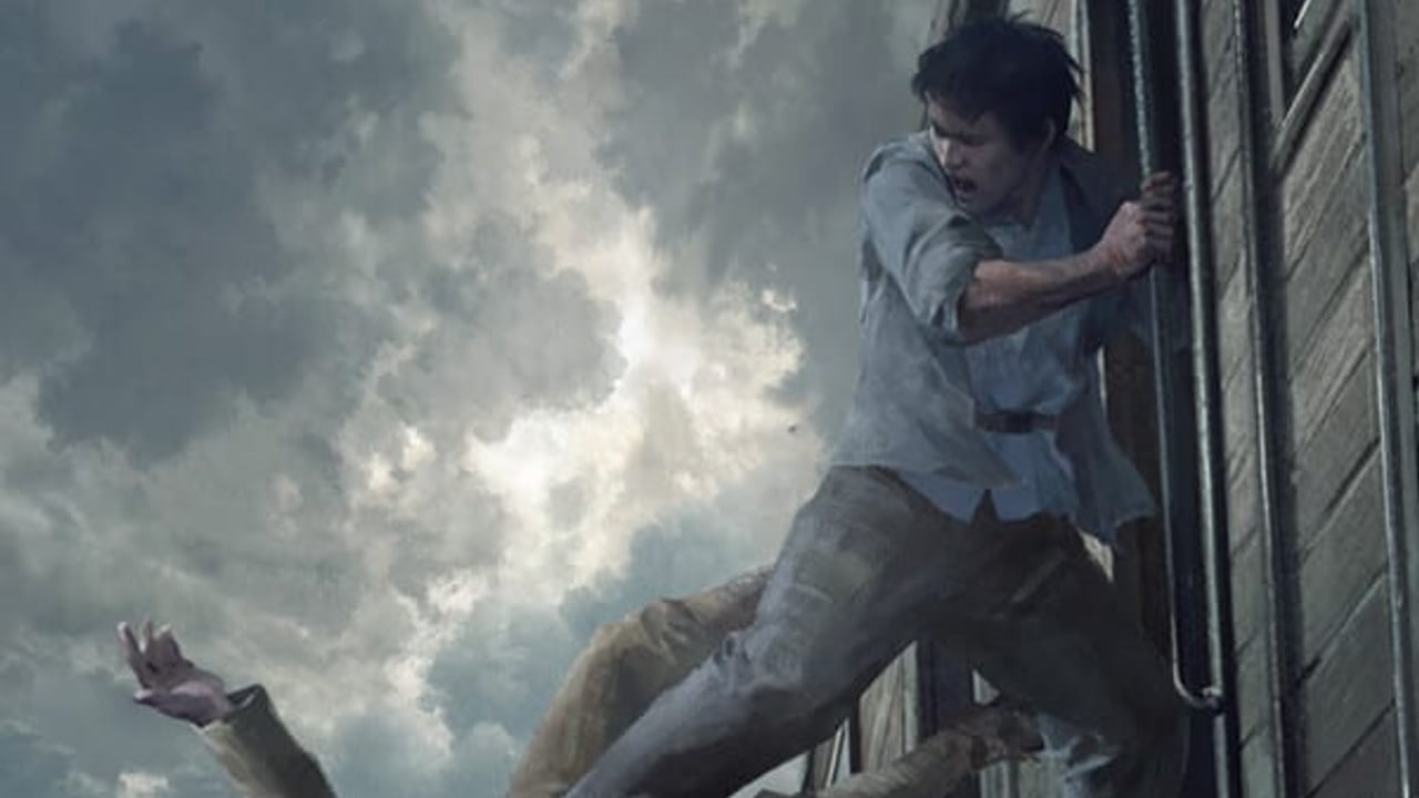 The Defiant key art of a resistance fighter kicking an enemy off a moving wartime train